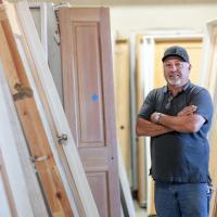 This and That Building Materials This and That Building Materials owner, Tomas Rascon, standing in front of a door