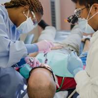 Castro, DDS with patient